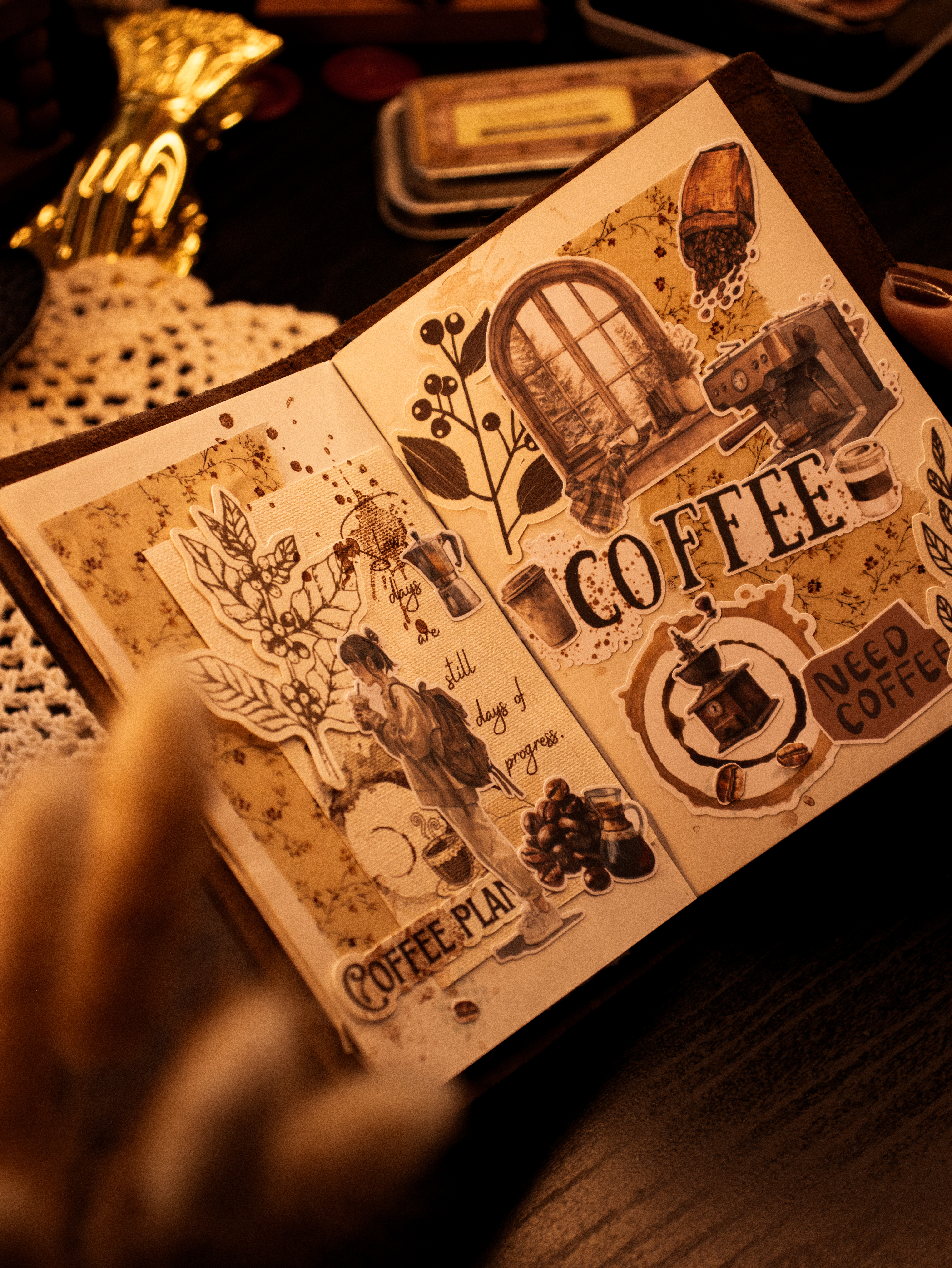 An open handmade journal spread filled with collected details