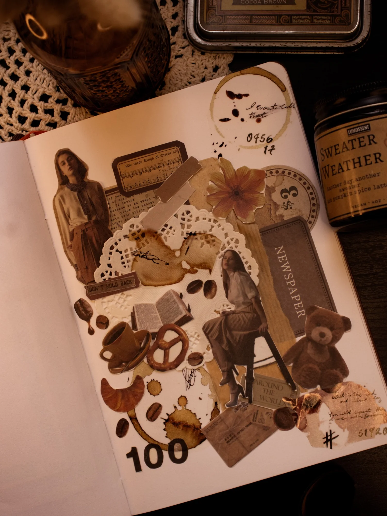 An autumn-toned journal page with a flower, seasonal keepsakes, and a sweater-weather label