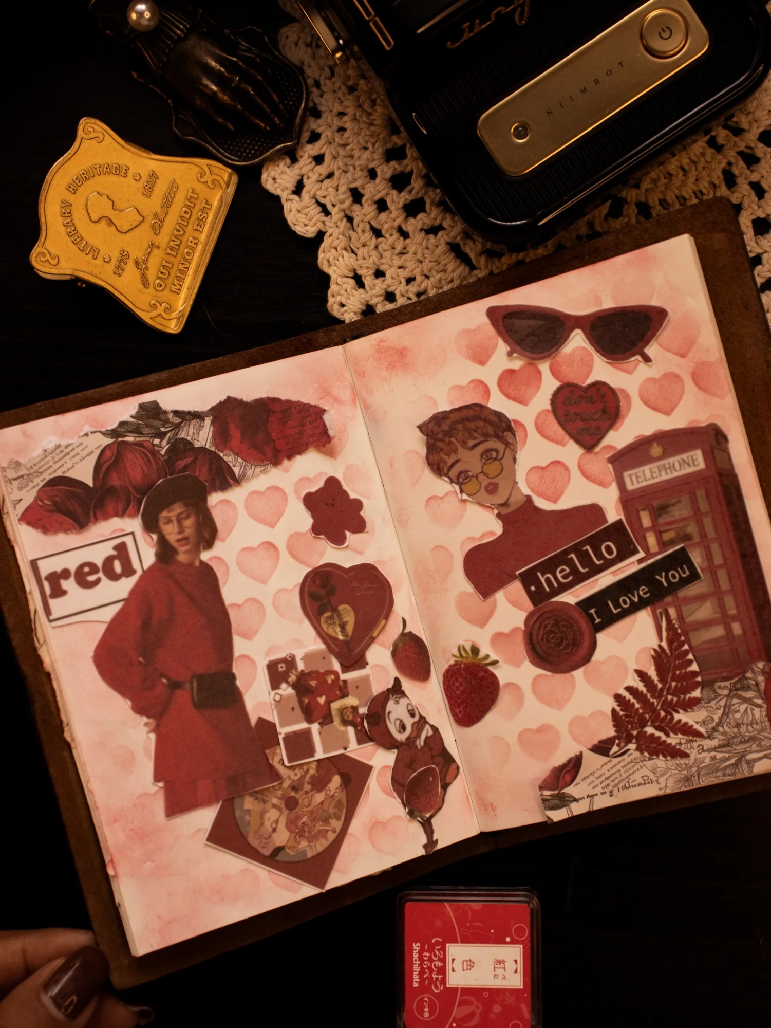 A journal spread layered with vintage portraits, pink-toned paper, and red postage details